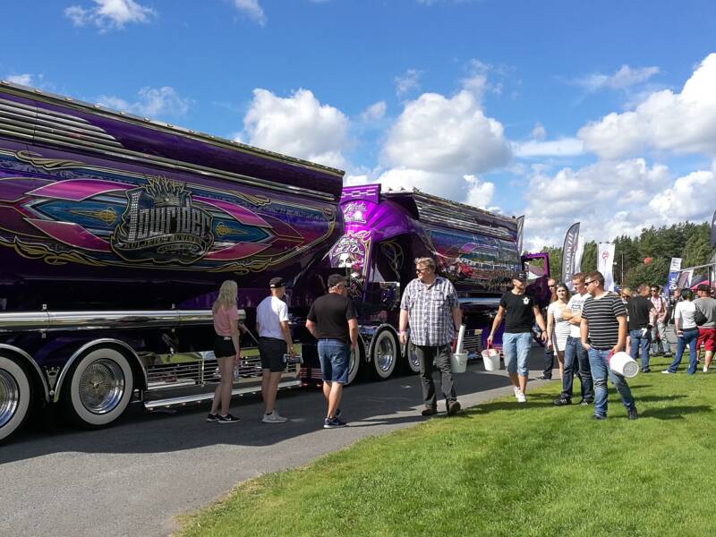 Power Truck customers viewing the displayed equipment.